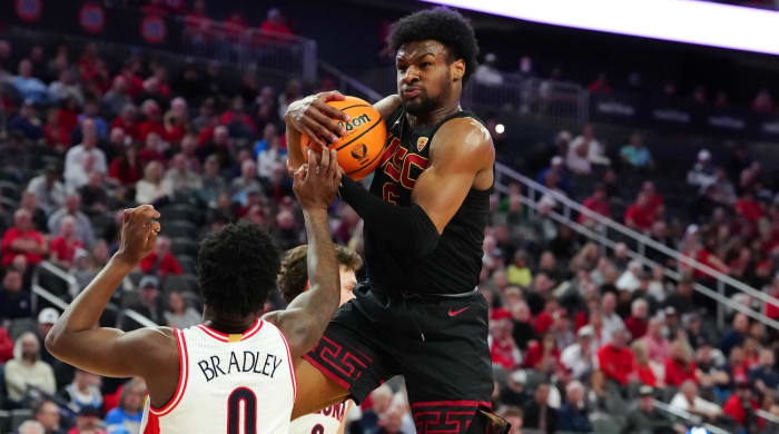 Southern California Trojans guard Bronny James (6) pulls down a defensive rebound from Arizona Wildcats guard Jaden Bradley (0) during the first half at T-Mobile Arena in Las Vegas on March 14, 2024.